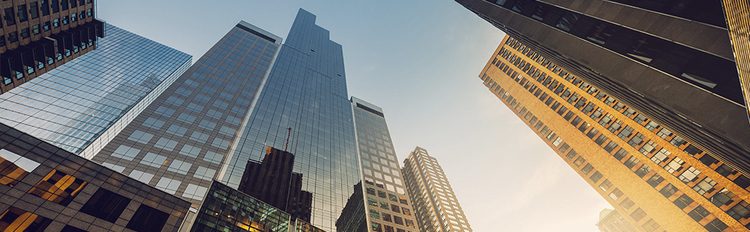 looking up at skyscrapers